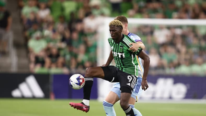 Mar 25, 2023; Austin, Texas, USA;  Austin FC forward Gyasi Zardes (9) battles for the ball with Colorado Rapids defender Andreas Maxso (5) in the first half at Q2 Stadium. Mandatory Credit: Erich Schlegel-USA TODAY Sports