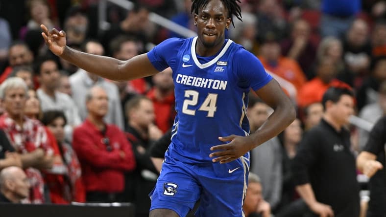 Mar 26, 2023; Louisville, KY, USA;  Creighton Bluejays forward Arthur Kaluma (24) celebrates scoring a basket during the second half against the San Diego State Aztecs at the NCAA Tournament South Regional-Creighton vs San Diego State at KFC YUM! Center.  Mandatory Credit: Jamie Rhodes-USA TODAY Sports