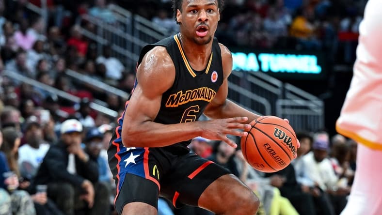 Mar 28, 2023; Houston, TX, USA; McDonald's All American West guard Bronny James (6) controls the ball during the first half against the McDonald's All American East at Toyota Center. Mandatory Credit: Maria Lysaker-USA TODAY Sports