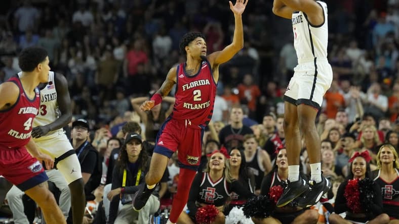 Apr 1, 2023; Houston, TX, USA; San Diego State Aztecs guard Lamont Butler (5) scores the game-winning basket over Florida Atlantic Owls guard Nicholas Boyd (2) in the semifinals of the Final Four of the 2023 NCAA Tournament at NRG Stadium. Mandatory Credit: Robert Deutsch-USA TODAY Sports