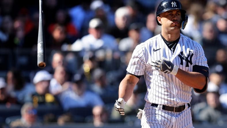 Apr 2, 2023; Bronx, New York, USA; New York Yankees designated hitter Giancarlo Stanton (27) tosses his bat after drawing a walk during the seventh inning against the San Francisco Giants at Yankee Stadium. Mandatory Credit: Brad Penner-USA TODAY Sports