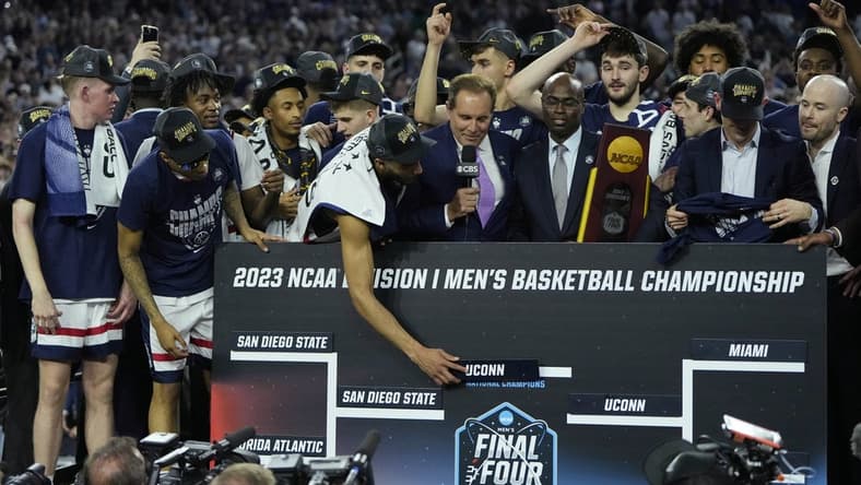 Apr 3, 2023; Houston, TX, USA; Connecticut Huskies players celebrates after defeating the San Diego State Aztecs in the national championship game of the 2023 NCAA Tournament at NRG Stadium. Mandatory Credit: Bob Donnan-USA TODAY Sports