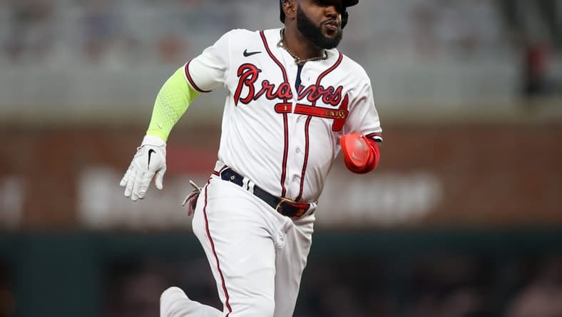 Apr 11, 2023; Atlanta, Georgia, USA; Atlanta Braves designated hitter Marcell Ozuna (20) runs to third against the Cincinnati Reds in the fourth inning at Truist Park. Mandatory Credit: Brett Davis-USA TODAY Sports