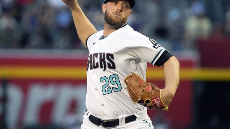 Apr 11, 2023; Phoenix, Arizona, USA; Arizona Diamondbacks starting pitcher Merrill Kelly (29) throws against the Milwaukee Brewers in the first inning at Chase Field. Mandatory Credit: Rick Scuteri-USA TODAY Sports