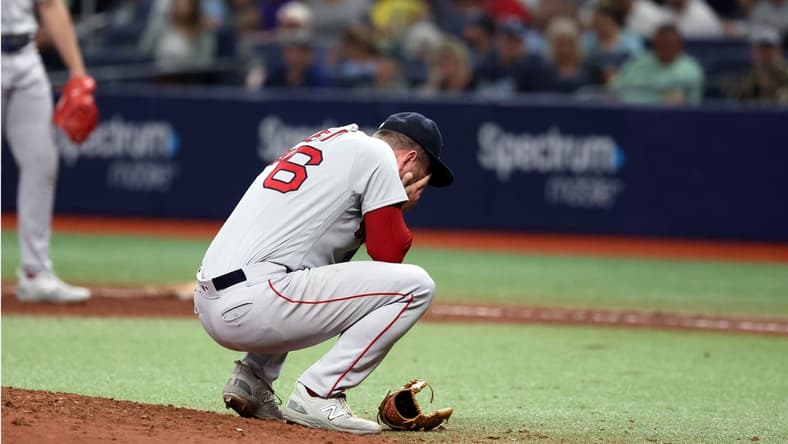 Apr 12, 2023; St. Petersburg, Florida, USA; Boston Red Sox relief pitcher Zack Kelly (76) reacts after a pitch against the Tampa Bay Rays during the fifth inning at Tropicana Field. Mandatory Credit: Kim Klement-USA TODAY Sports