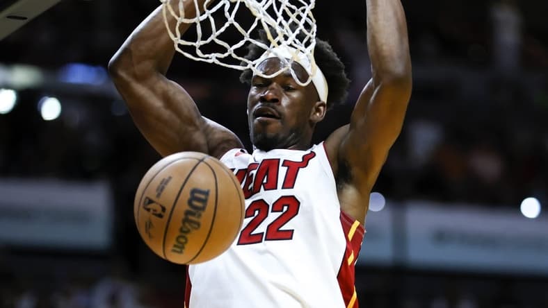 Apr 14, 2023; Miami, Florida, USA; Miami Heat forward Jimmy Butler (22) dunks the basketball during the first quarter against the Chicago Bulls at Kaseya Center. Mandatory Credit: Sam Navarro-USA TODAY Sports