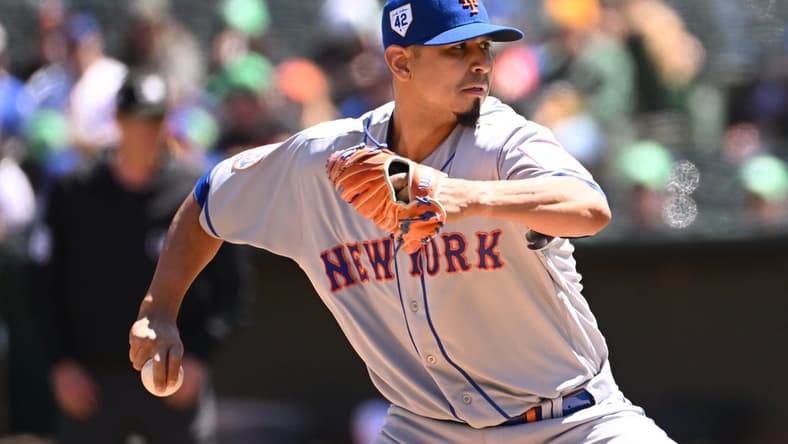 Apr 15, 2023; Oakland, California, USA; New York Mets starting pitcher Carlos Carrasco (59) throws against the Oakland Athletics during the first inning at RingCentral Coliseum. Mandatory Credit: Robert Edwards-USA TODAY Sports