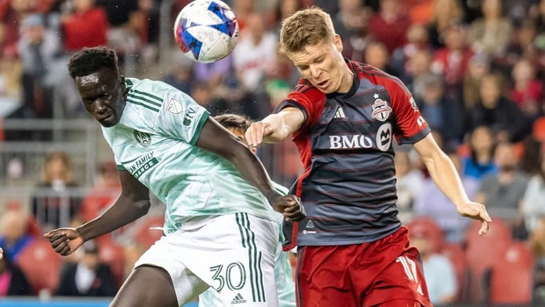 Apr 15, 2023; Toronto, Ontario, CAN;  Atlanta United forward Machop Chol (30) heads the ball before scoring against Toronto FC during the second half at BMO Field. Mandatory Credit: Kevin Sousa-USA TODAY Sports
