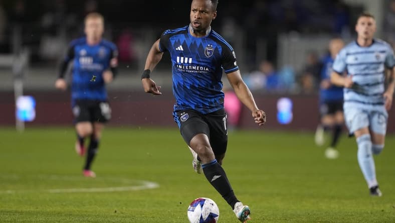 Apr 15, 2023; San Jose, California, USA; San Jose Earthquakes forward Jeremy Ebobisse (11) dribbles against Sporting Kansas City during the second half at PayPal Park. Mandatory Credit: Darren Yamashita-USA TODAY Sports