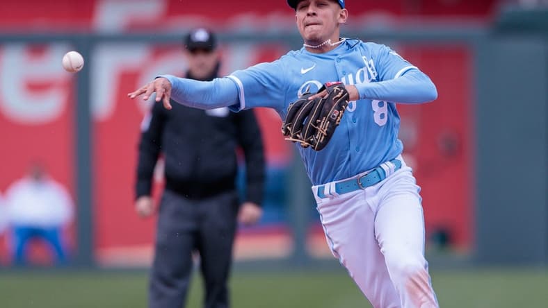 Apr 16, 2023; Kansas City, Missouri, USA; Kansas City Royals shortstop Nicky Lopez (8) throws to first base during the sixth inning against the Atlanta Braves at Kauffman Stadium. Mandatory Credit: William Purnell-USA TODAY Sports