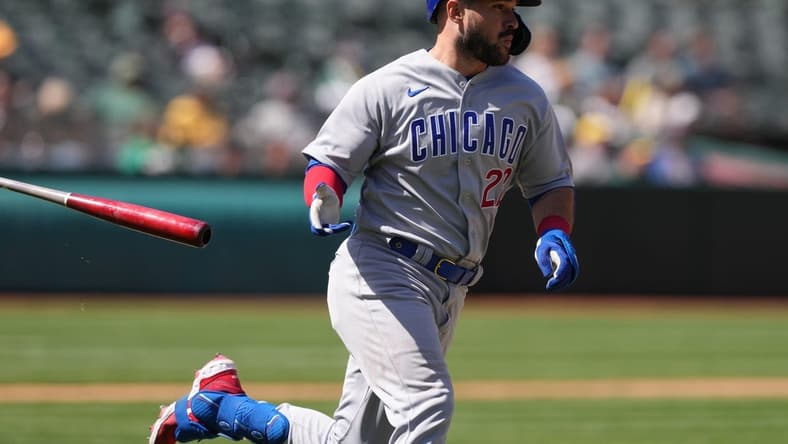 Apr 19, 2023; Oakland, California, USA; Chicago Cubs catcher Luis Torrens (22) tosses his bat while running to first base after hitting an RBI-double against the Oakland Athletics during the ninth inning at Oakland-Alameda County Coliseum. Mandatory Credit: Darren Yamashita-USA TODAY Sports