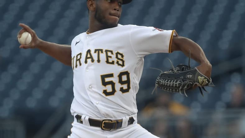 Apr 20, 2023; Pittsburgh, Pennsylvania, USA;  Pittsburgh Pirates starting pitcher Roansy Contreras (59) delivers a pitch against the Cincinnati Reds during the first inning at PNC Park. Mandatory Credit: Charles LeClaire-USA TODAY Sports