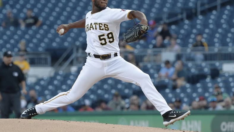 Apr 20, 2023; Pittsburgh, Pennsylvania, USA; Pittsburgh Pirates starting pitcher Roansy Contreras (59) delivers a pitch against the Cincinnati Reds during the first inning at PNC Park. Mandatory Credit: Charles LeClaire-USA TODAY Sports