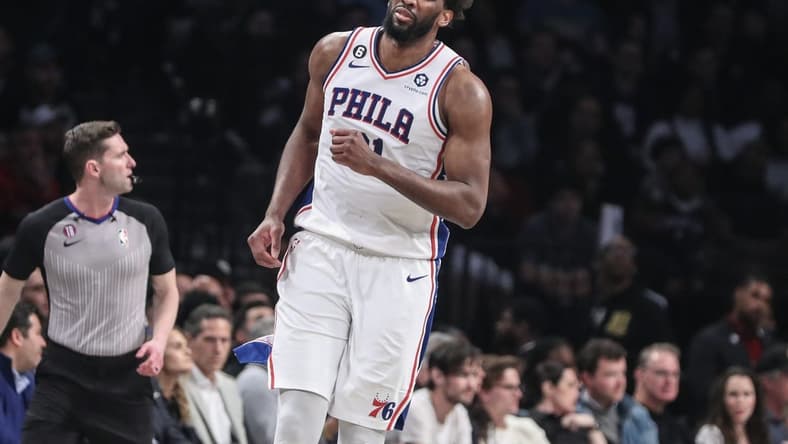 Apr 20, 2023; Brooklyn, New York, USA; Philadelphia 76ers center Joel Embiid (21) grimaces during game three of the 2023 NBA playoffs against the Brooklyn Nets at Barclays Center. Mandatory Credit: Wendell Cruz-USA TODAY Sports