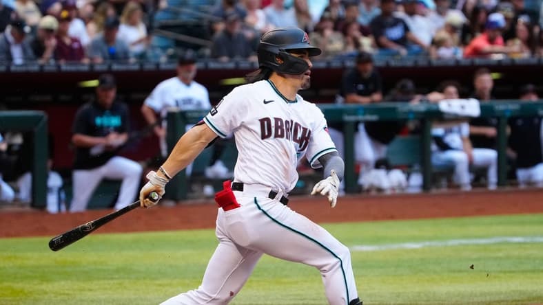 Diamondbacks Corbin Carroll (7) hits a double down the line against the Padres in the first inning during a game at Chase Field on April 22, 2023.

Mlb Padres At D Backs
