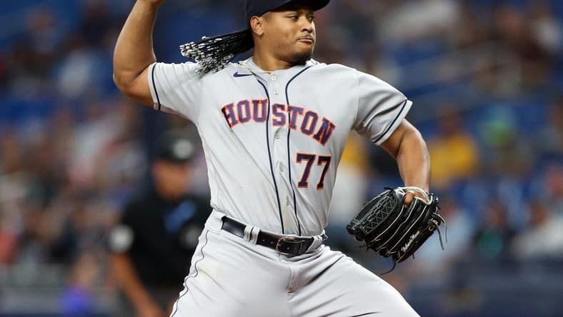 Apr 25, 2023; St. Petersburg, Florida, USA;  Houston Astros starting pitcher Luis Garcia (77) throws a pitch  against the Tampa Bay Rays in the first inning at Tropicana Field. Mandatory Credit: Nathan Ray Seebeck-USA TODAY Sports