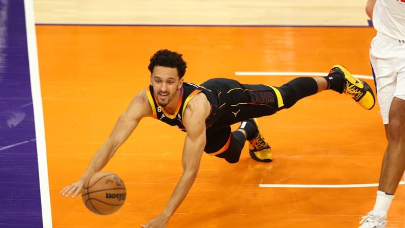 Apr 25, 2023; Phoenix, Arizona, USA; Phoenix Suns guard Landry Shamet dives for a loose ball against the Los Angeles Clippers during the second half in game five of the 2023 NBA playoffs at Footprint Center. Mandatory Credit: Mark J. Rebilas-USA TODAY Sports
