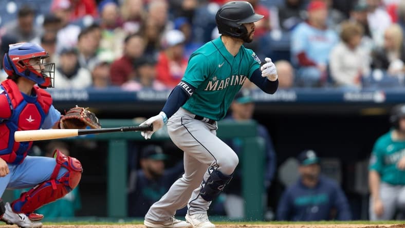 Apr 27, 2023; Philadelphia, Pennsylvania, USA; Seattle Mariners third baseman Tommy La Stella (4) hits a single during the seventh inning against the Philadelphia Phillies at Citizens Bank Park. Mandatory Credit: Bill Streicher-USA TODAY Sports