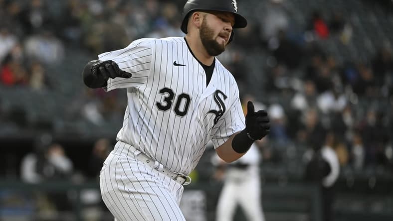 Apr 27, 2023; Chicago, Illinois, USA; Chicago White Sox third baseman Jake Burger (30) reacts after hitting a home run against the Tampa Bay Rays during the fourth inning at Guaranteed Rate Field. Mandatory Credit: Matt Marton-USA TODAY Sports