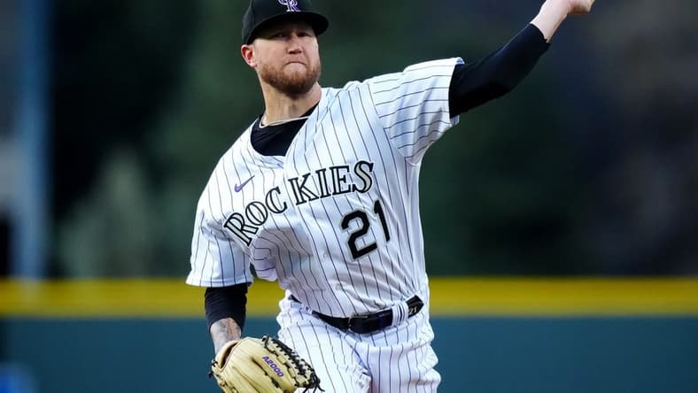 Apr 28, 2023; Denver, Colorado, USA; Colorado Rockies starting pitcher Kyle Freeland (21) delivers a pitch in the first inning against the Arizona Diamondbacks at Coors Field. Mandatory Credit: Ron Chenoy-USA TODAY Sports