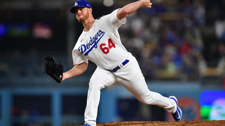 Apr 28, 2023; Los Angeles, California, USA; Los Angeles Dodgers relief pitcher Caleb Ferguson (64) throws against the St. Louis Cardinals during the sixth inning at Dodger Stadium. Mandatory Credit: Gary A. Vasquez-USA TODAY Sports