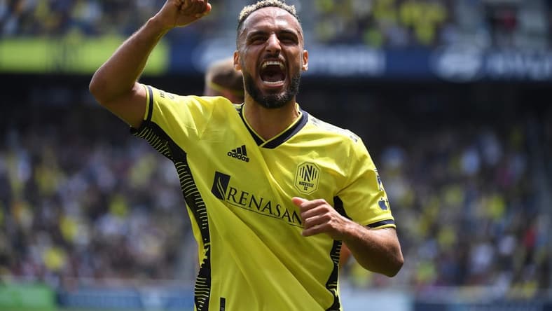 Apr 29, 2023; Nashville, TN, USA; Nashville SC midfielder Hany Mukhtar (10) celebrates after assisting on a goal by Nashville SC midfielder Fafa Picault (not pictured) against the Atlanta United in the first half of a MLS game at Geodis Park. Mandatory Credit: Christopher Hanewinckel-USA TODAY Sports