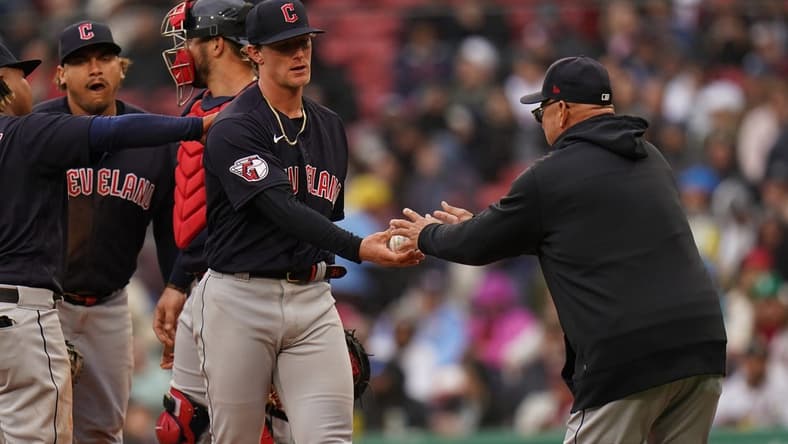 Apr 29, 2023; Boston, Massachusetts, USA; Cleveland Guardians starting pitcher Zach Plesac (34) is taken out of the game by manager Terry Francona (77) as they take on the Boston Red Sox in the fourth inning at Fenway Park. Mandatory Credit: David Butler II-USA TODAY Sports