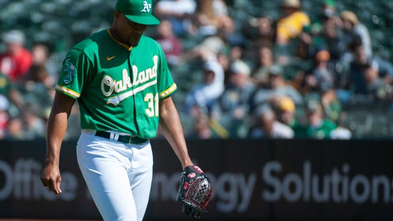 Apr 29, 2023; Oakland, California, USA; Oakland Athletics relief pitcher Jeurys Familia (31) walks back to the dugout after the top of the 9th inning at RingCentral Coliseum. Mandatory Credit: Ed Szczepanski-USA TODAY Sports