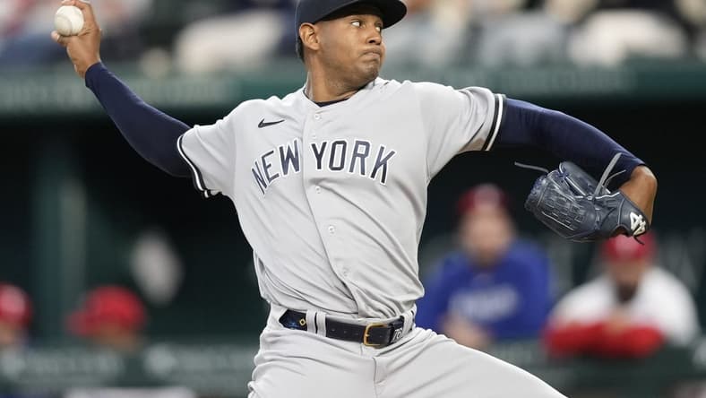 Apr 29, 2023; Arlington, Texas, USA; New York Yankees starting pitcher Jhony Brito (76) delivers against the Texas Rangers during the third inning at Globe Life Field. Mandatory Credit: Jim Cowsert-USA TODAY Sports