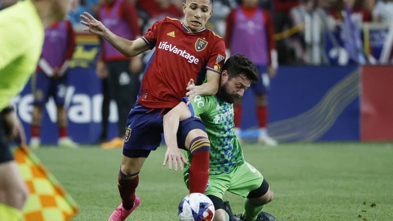 Apr 29, 2023; Sandy, Utah, USA; Real Salt Lake forward Jefferson Savarino (10) and Seattle Sounders midfielder Joao Paulo (6) battle in the second half at America First Field. Mandatory Credit: Jeffrey Swinger-USA TODAY Sports
