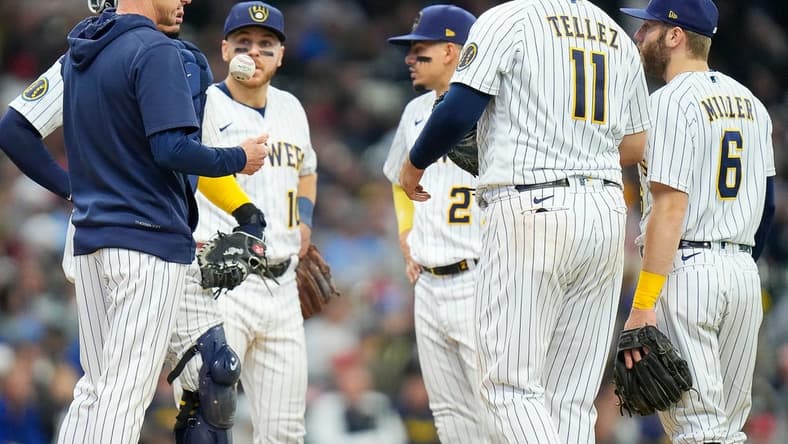 Brewers players meet at the pitching mound as they fall behind the Angels during the seventh inning on Sunday April 30, 2023 at American Family Field in Milwaukee, Wis.