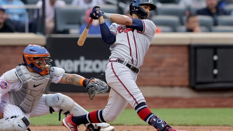 May 1, 2023; New York City, New York, USA; Atlanta Braves left fielder Eddie Rosario (8) follows through on a three run double against the New York Mets during the sixth inning at Citi Field. Mandatory Credit: Brad Penner-USA TODAY Sports