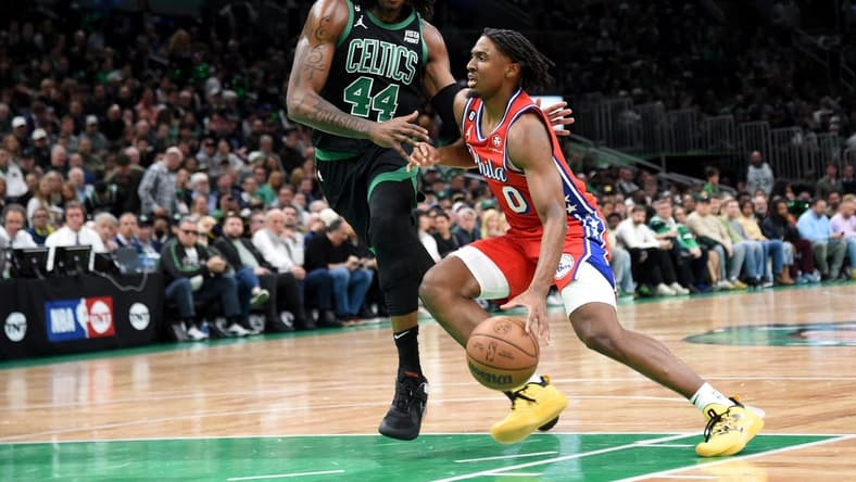 May 1, 2023; Boston, Massachusetts, USA; Philadelphia 76ers guard Tyrese Maxey (0) controls the ball while Boston Celtics center Robert Williams III (44) defends in the first half during game one of the 2023 NBA playoffs at TD Garden. Mandatory Credit: Bob DeChiara-USA TODAY Sports