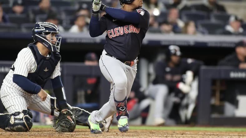 May 1, 2023; Bronx, New York, USA;  Cleveland Guardians third baseman Jose Ramirez (11) hits a single in the ninth inning against the New York Yankees at Yankee Stadium. Mandatory Credit: Wendell Cruz-USA TODAY Sports