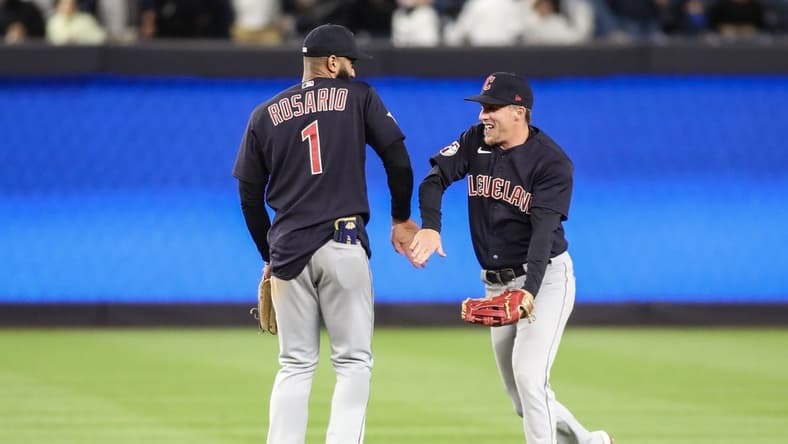 May 1, 2023; Bronx, New York, USA;  Cleveland Guardians shortstop Amed Rosario (1) and center fielder Myles Straw (7) celebrate after defeating the New York Yankees 3-2 at Yankee Stadium. Mandatory Credit: Wendell Cruz-USA TODAY Sports