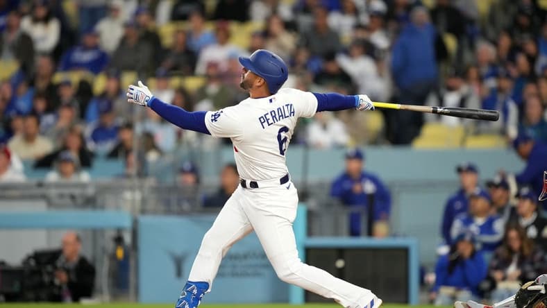 May 1, 2023; Los Angeles, California, USA; Los Angeles Dodgers left fielder David Peralta (6) hits a home run in the second inning against the Philadelphia Phillies at Dodger Stadium. Mandatory Credit: Kirby Lee-USA TODAY Sports