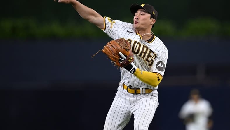 May 1, 2023; San Diego, California, USA; San Diego Padres second baseman Ha-Seong Kim (7) throws to first base during the sixth inning against the Cincinnati Reds at Petco Park. Mandatory Credit: Orlando Ramirez-USA TODAY Sports