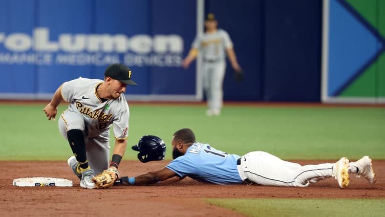 May 2, 2023; St. Petersburg, Florida, USA; Tampa Bay Rays center fielder Manuel Margot (13) slides safe into second base as Pittsburgh Pirates second baseman Mark Mathias (6) attempts to tag him out during the third inning at Tropicana Field. Mandatory Credit: Kim Klement-USA TODAY Sports