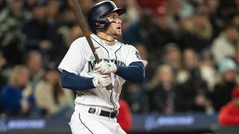 Apr 22, 2023; Seattle, Washington, USA; Seattle Mariners left fielder Jarred Kelenic (10) hits a double against the St. Louis Cardinals at T-Mobile Park. Mandatory Credit: Stephen Brashear-USA TODAY Sports