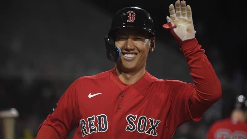 May 2, 2023; Boston, Massachusetts, USA;  Boston Red Sox designated hitter Masataka Yoshida (7) high fives a teammate after hitting a home run during the fourth inning against the Toronto Blue Jays at Fenway Park. Mandatory Credit: Bob DeChiara-USA TODAY Sports