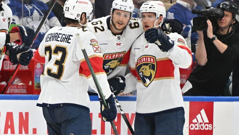 May 2, 2023; Toronto, Ontario, CANADA; Florida Panthers forward Carter Verhaeghe (23) celebrates at the bench with defensemen Gustav Forsling (42) and Brandon Montour (62) after scoring against the Toronto Maple Leafs in the second period in game one of the second round of the 2023 Stanley Cup Playoffs at Scotiabank Arena. Mandatory Credit: Dan Hamilton-USA TODAY Sports