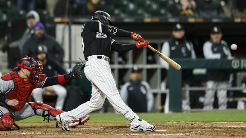 May 2, 2023; Chicago, Illinois, USA; Chicago White Sox left fielder Andrew Benintendi (23) hits a walk-off single against the Minnesota Twins during the 10th inning at Guaranteed Rate Field. Mandatory Credit: Kamil Krzaczynski-USA TODAY Sports