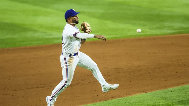 May 2, 2023; Arlington, Texas, USA; Texas Rangers shortstop Ezequiel Duran (20) fields a ground ball and throws to first base during the sixth inning against the Arizona Diamondbacks at Globe Life Field. Mandatory Credit: Kevin Jairaj-USA TODAY Sports