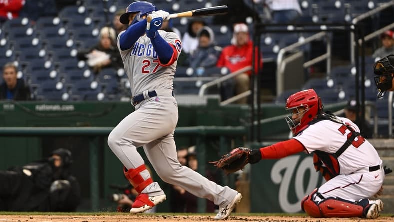 May 3, 2023; Washington, District of Columbia, USA; Chicago Cubs right fielder Seiya Suzuki (27) hits a RBI single against the Washington Nationals during the first inning at Nationals Park. Mandatory Credit: Brad Mills-USA TODAY Sports