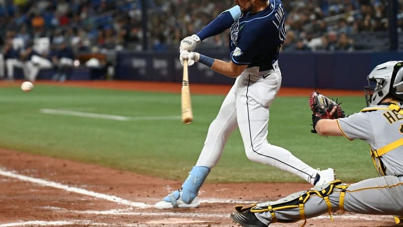 May 3, 2023; St. Petersburg, Florida, USA; Tampa Bay Rays right fielder Josh Lowe (15) hits a solo home run in the sixth inning against the Pittsburgh Pirates at Tropicana Field. Mandatory Credit: Jonathan Dyer-USA TODAY Sports