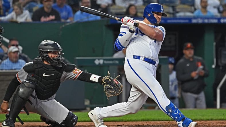 May 3, 2023; Kansas City, Missouri, USA;  Kansas City Royals designated hitter Vinnie Pasquantino (9) hits an RBI double during the seventh inning against the Baltimore Orioles at Kauffman Stadium. Mandatory Credit: Peter Aiken-USA TODAY Sports