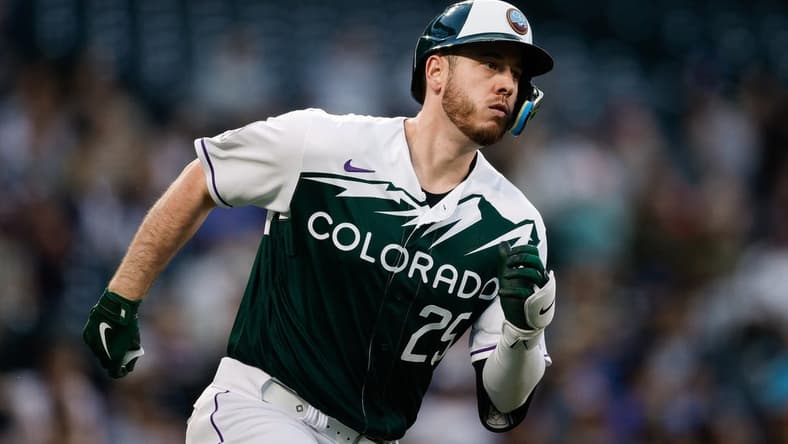May 3, 2023; Denver, Colorado, USA; Colorado Rockies first baseman C.J. Cron (25) runs to second on a double in the fourth inning against the Milwaukee Brewers at Coors Field. Mandatory Credit: Isaiah J. Downing-USA TODAY Sports