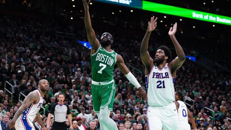 May 3, 2023; Boston, Massachusetts, USA; Boston Celtics guard Jaylen Brown (7) drives to the basket against Philadelphia 76ers center Joel Embiid (21) in the third quarter during game two of the 2023 NBA playoffs at TD Garden. Mandatory Credit: David Butler II-USA TODAY Sports