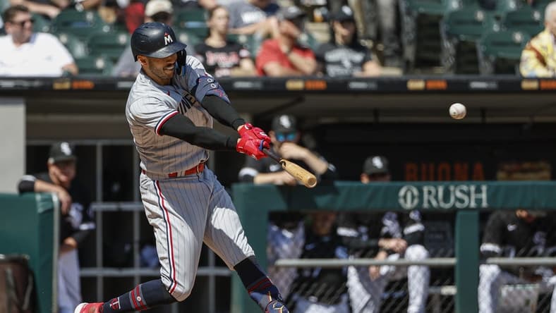 May 4, 2023; Chicago, Illinois, USA; Minnesota Twins shortstop Carlos Correa (4) hits a solo home run against the Chicago White Sox during the sixth inning at Guaranteed Rate Field. Mandatory Credit: Kamil Krzaczynski-USA TODAY Sports