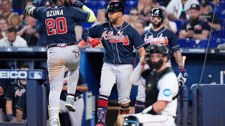 May 4, 2023; Miami, Florida, USA; Atlanta Braves designated hitter Marcell Ozuna (20) celebrates with teammates after hitting a home run against the Miami Marlins during the fourth inning at loanDepot Park. Mandatory Credit: Rich Storry-USA TODAY Sports